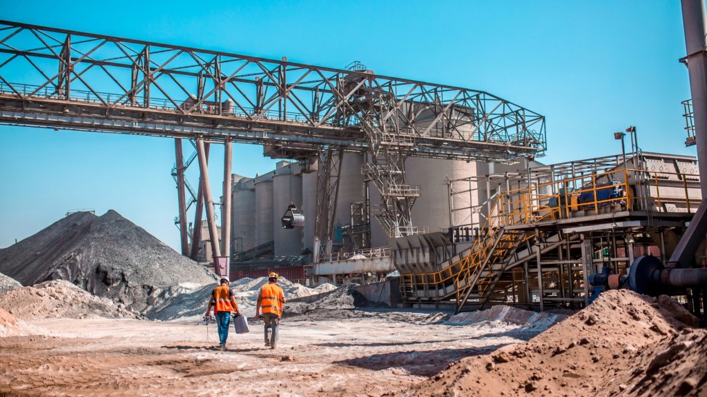 Open-air cement facility where rugged heavy duty fans handle abrasive dust extraction.