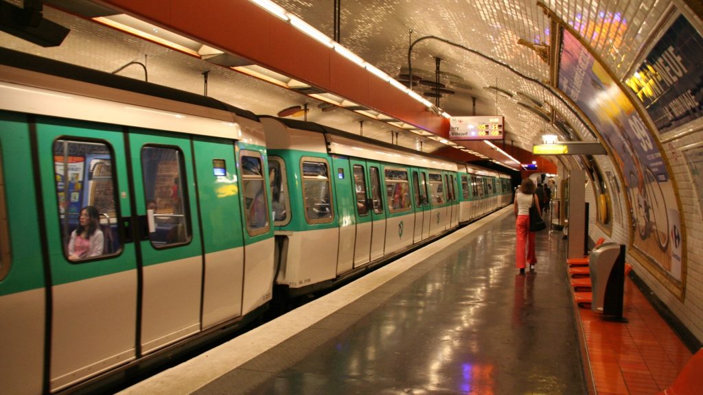 Underground metro platform with train arriving, illustrating passenger comfort provided by modern ventilation systems for tunnels.